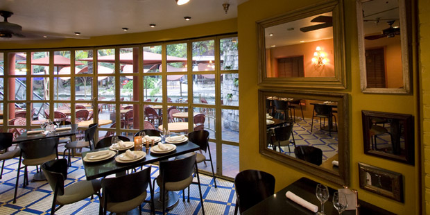 Indoor seating looking out on the San Antonio Riverwalk